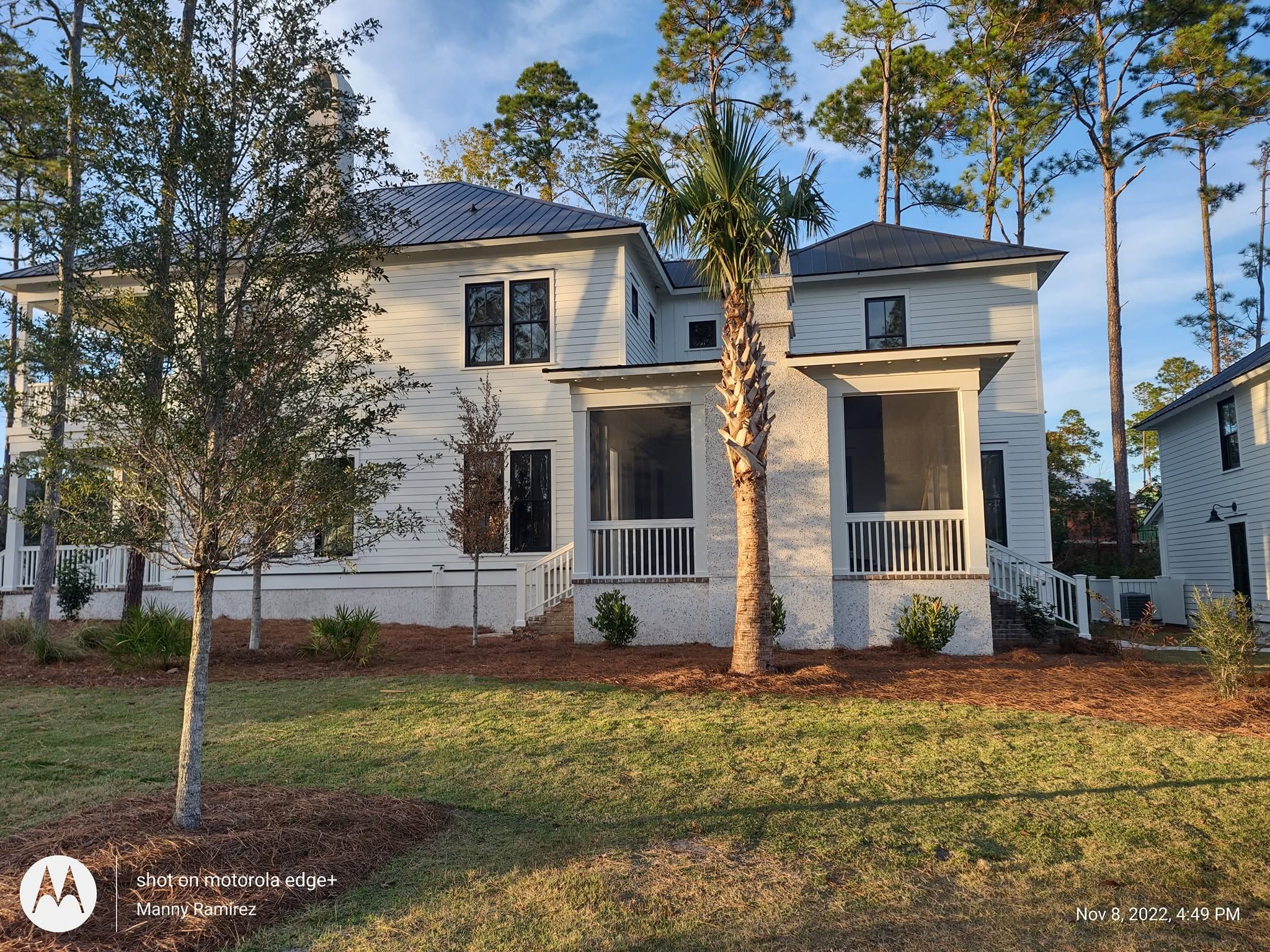 Freshly painted white Lowcountry home with black-trimmed windows