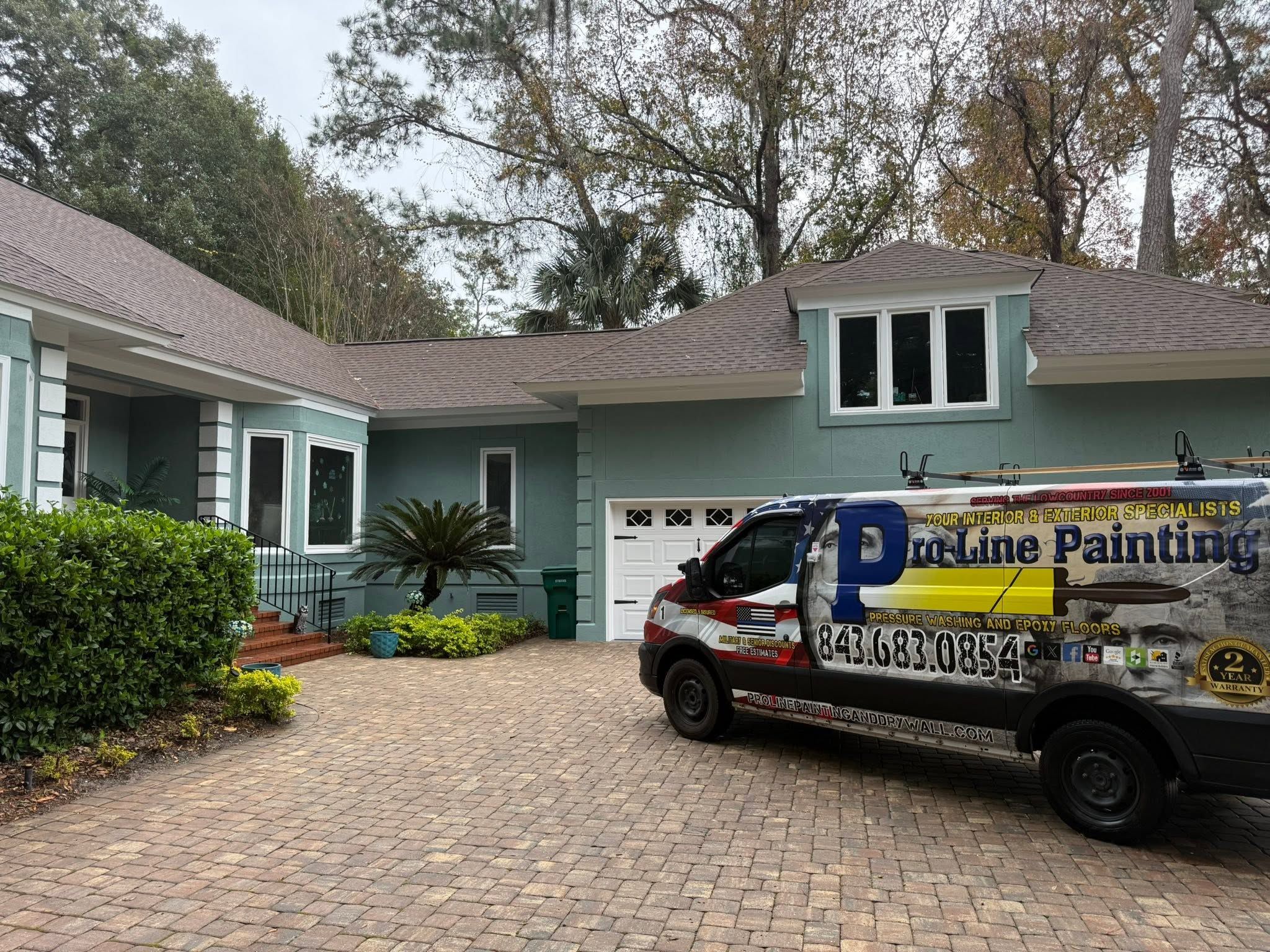 Pro-Line Painting van parked at a freshly painted sage-green Lowcountry home